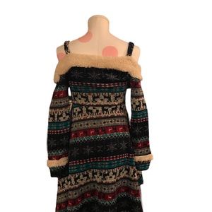 Holiday dress, reindeer print & faux shearling neckline/cuffs. 100% polyester.